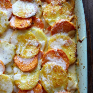 pumpkin scalloped potatoes in a casserole dish