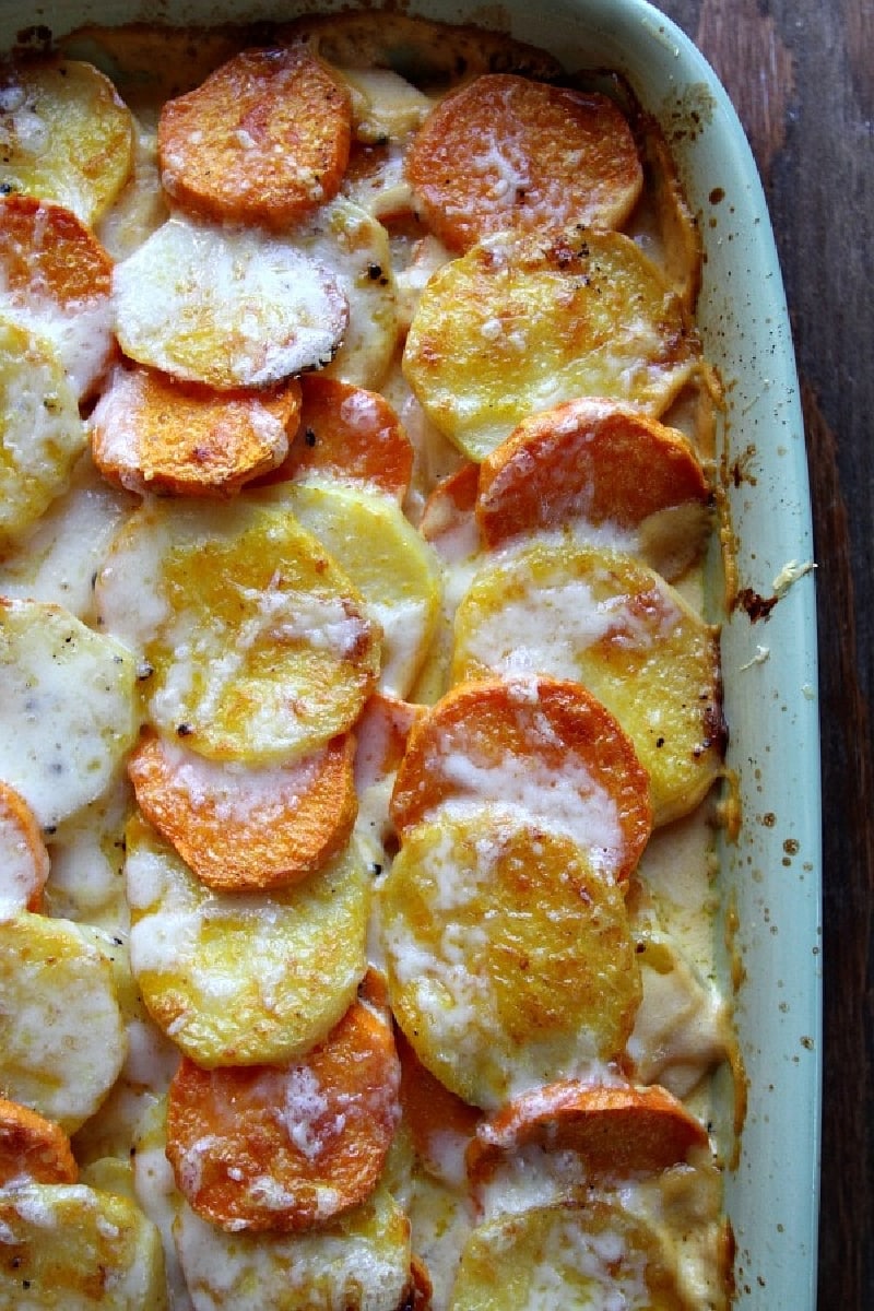 pumpkin scalloped potatoes in a casserole dish