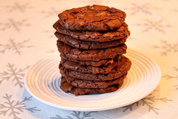 stack of Butterfinger Brownie Cookies on a white plate