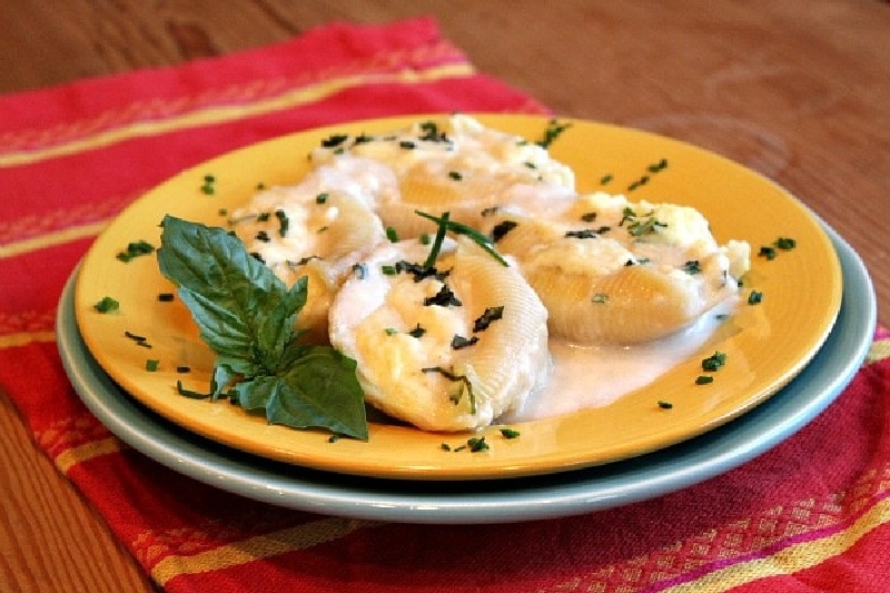 Three Cheese Stuffed Shells with Creamy White Sauce recipe from RecipeGirl.com #three #cheese #stuffed #shells #pasta #recipe #RecipeGirl three cheese stuffed shells on a plate