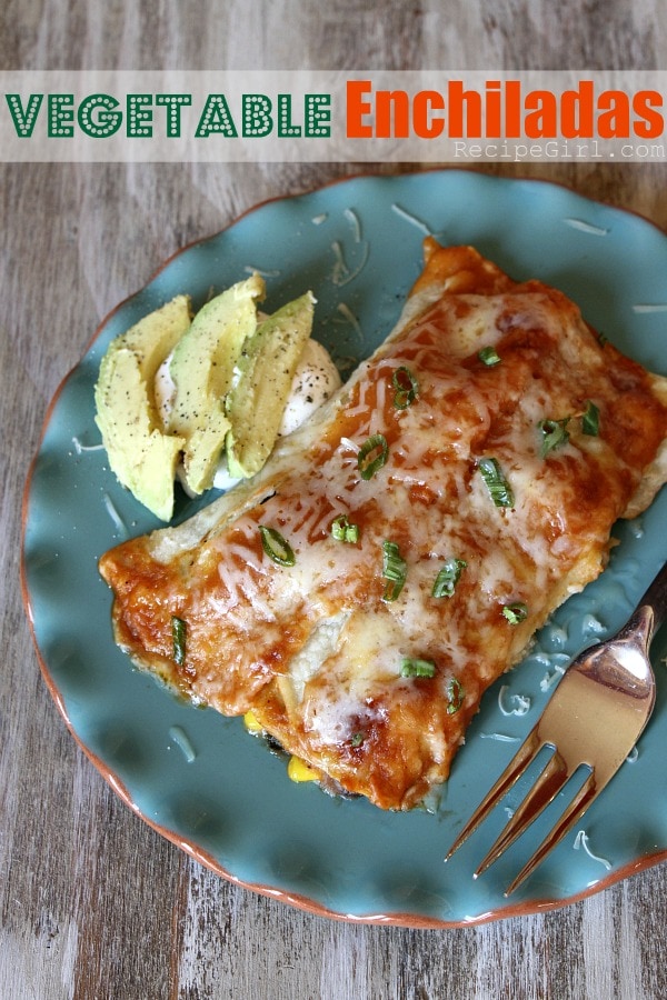 Vegetable Enchiladas from RecipeGirl.com #enchiladas #veggie #vegetableenchiladas #vegetarian #RecipeGirl vegetable enchiladas on a blue plate