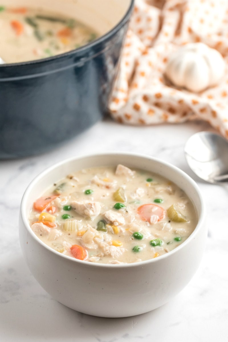 creamy chicken and rice soup in a white bowl