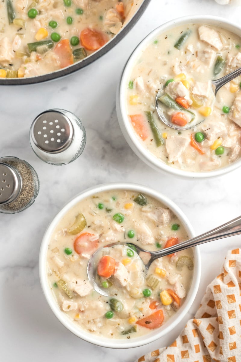 creamy chicken and rice soup in two bowls