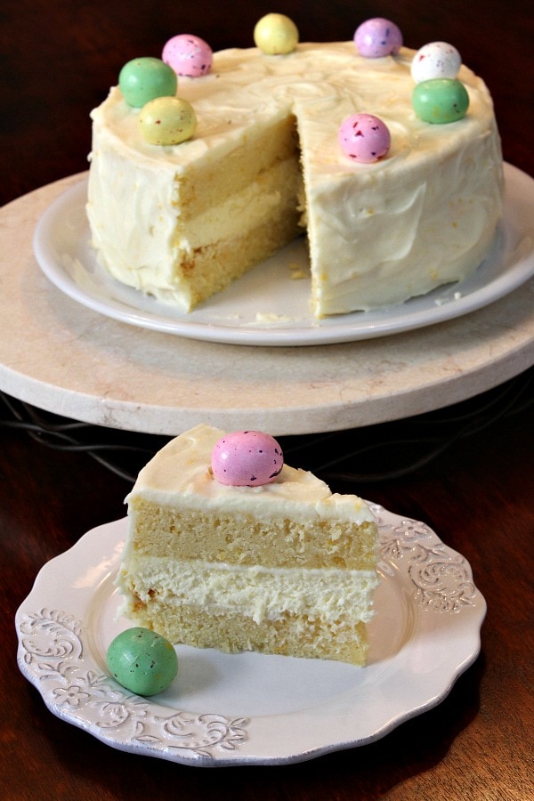 Lemon Cheesecake Cake on plate and slice on plate, garnished with chocolate Easter eggs