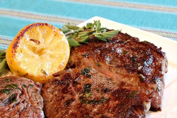 pan fried lemon- garlic rib eye steaks