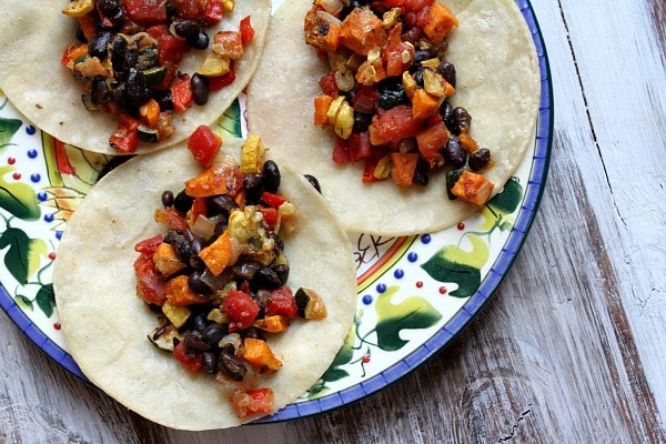 three open Roasted Vegetable and Black Bean Tacos on a plate