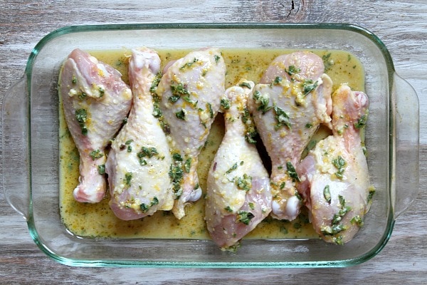 Sweet Lemon Glazed Drumsticks recipe from RecipeGirl.com #sweet #lemon #glazed #drumsticks #chicken #recipe #RecipeGirl Sweet Lemon Glazed Drumsticks in pan ready for oven
