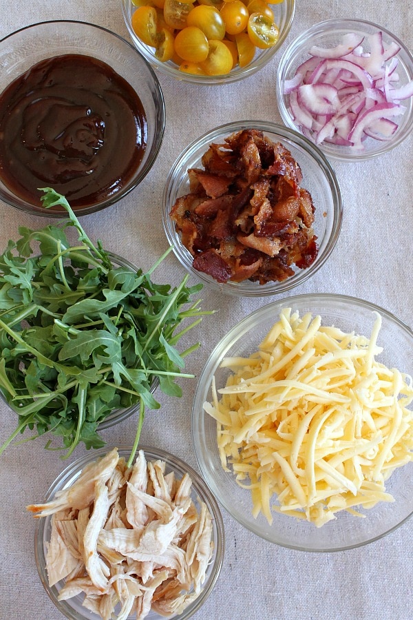 BBQ Chicken and Bacon Pizza recipe from RecipeGirl.com #bbq #barbecue #chicken #bacon #pizza #RecipeGIrl Toppings for BBQ Chicken and Bacon Pizza in bowls