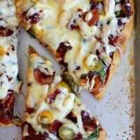 bbq chicken pizza with slice cut out