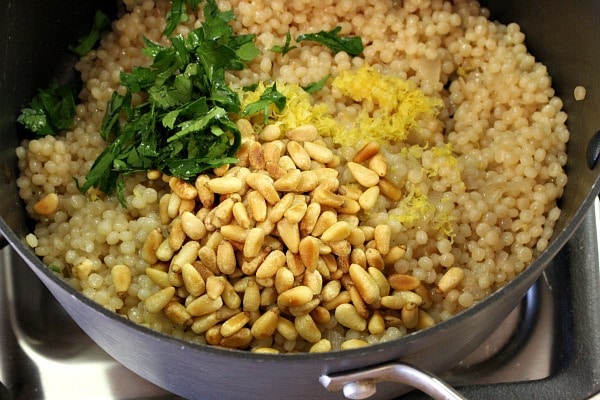 Israeli Couscous with Pine Nuts and Parsley recipe from RecipeGirl.com Israeli Couscous with Pine Nuts and Parsley in pan