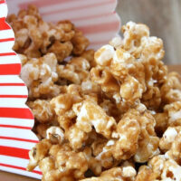 peanut butter caramel corn in a red and white popcorn box
