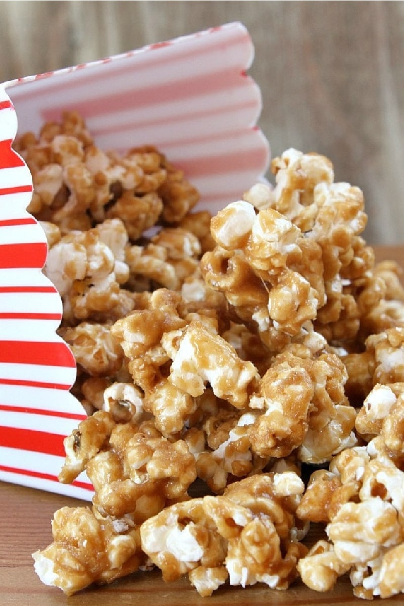 peanut butter caramel corn in a red and white popcorn box