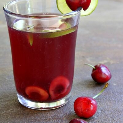 glass of cherry limeade sangria