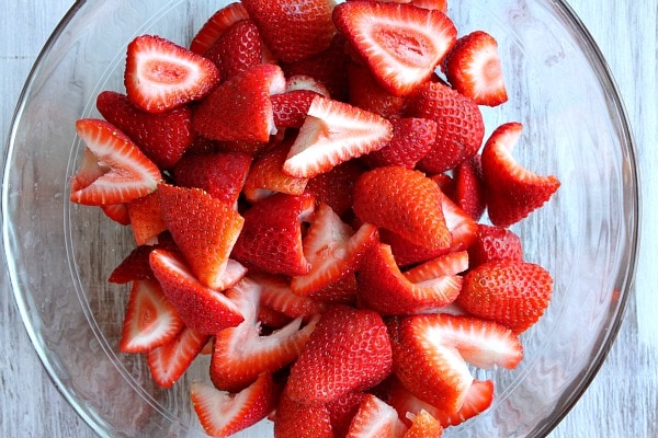 Chopped strawberries in a glass bowl