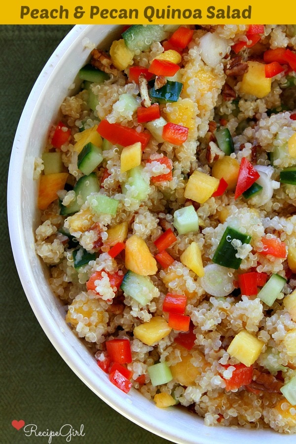 Peach and Pecan Quinoa Salad recipe from RecipeGirl.com #peach #pecan #quinoa #salad #recipe #RecipeGirl overhead shot of half a bowl of Peach and Pecan Quinoa Salad in a white bowl
