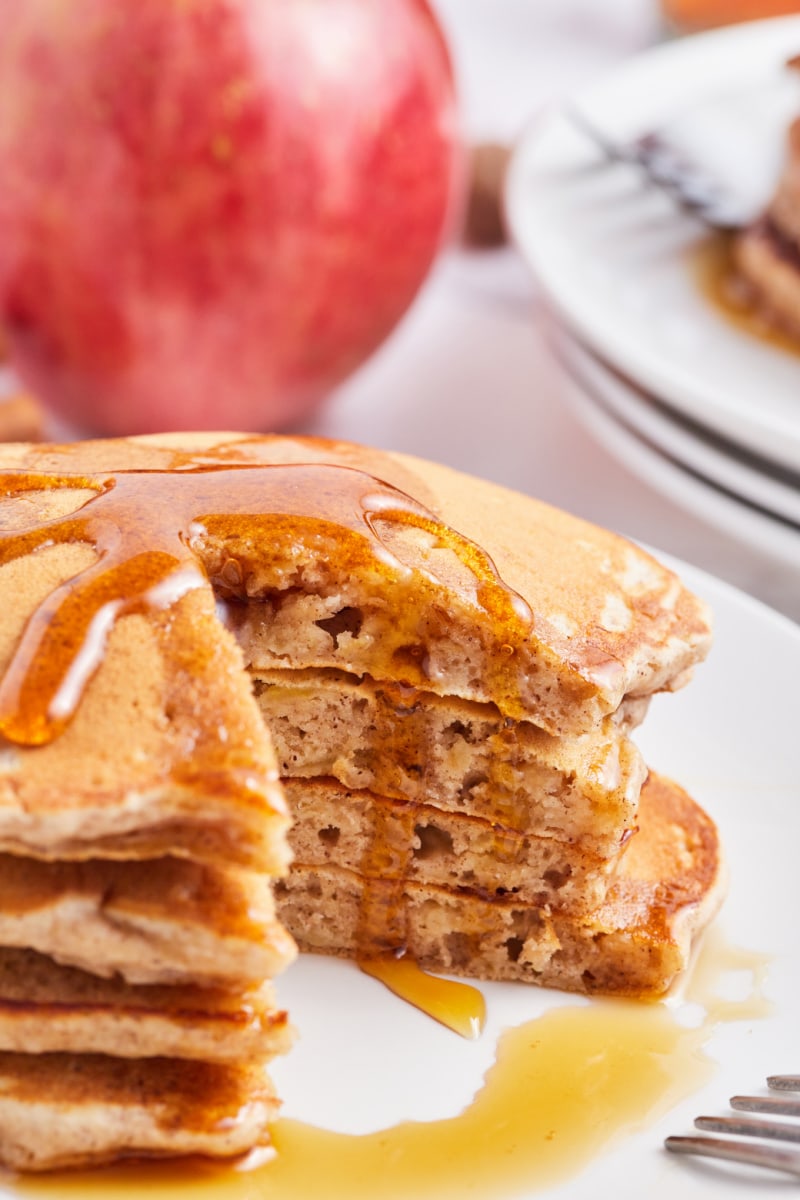 stack of apple pie pancakes with piece cut out