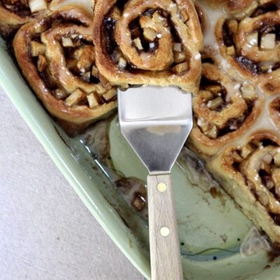 no yeast apple cinnamon rolls in green dish with spatula