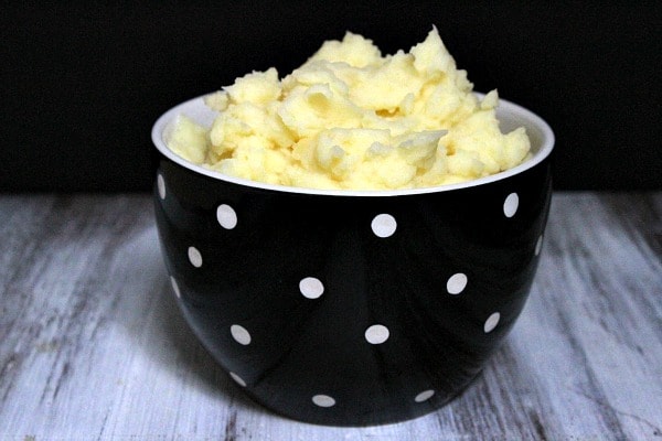 black and white bowl with mashed potatoes inside
