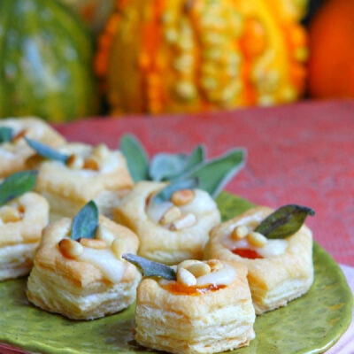 apricot brie bites appetizers on a green platter