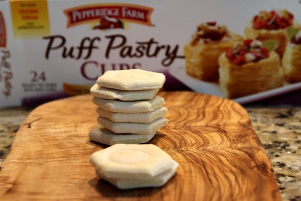 Puff Pastry Cups stacked on a cutting board