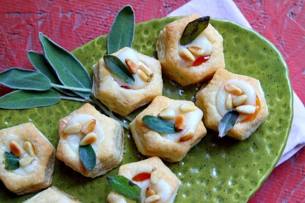 Apricot Brie Bites with Fried Sage on a green plate