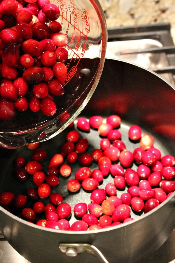 Adding cranberries to a pan
