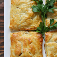 puff pastry pockets on a plate filled with turkey
