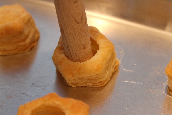 wooden dowell punching holes in puff pastry cups