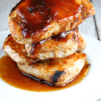 stack of barbecued pork chops on a plate