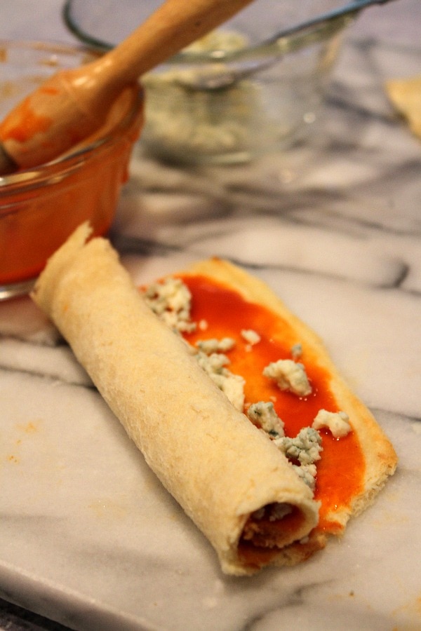 Blue Cheese Buffalo Bites rolled up and ready to cut