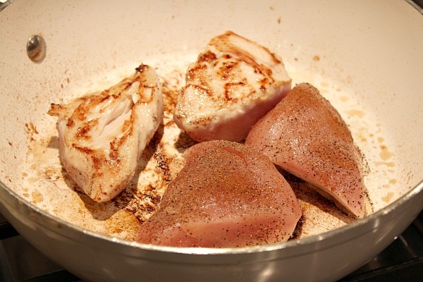Chicken with Apples and Cider recipe from RecipeGirl.com Chicken in pan