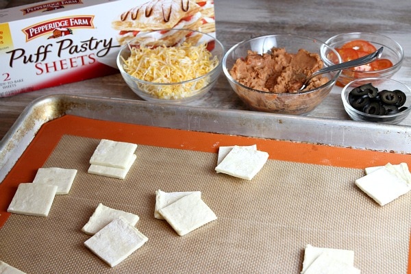 Puff pastry cut into pieces ready for making puff pastry nachos