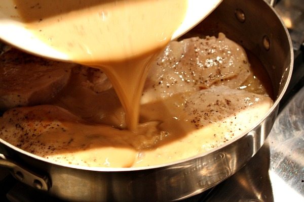 Pouring sauce onto chicken in pan
