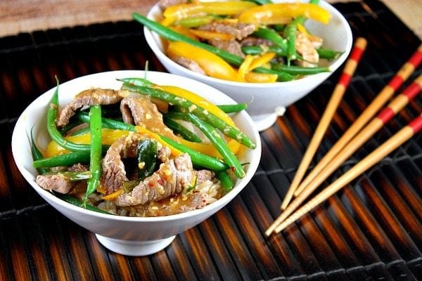 Szechuan Orange Ginger Beef recipe from RecipeGirl.com Szechuan Orange-Ginger Beef in two bowls