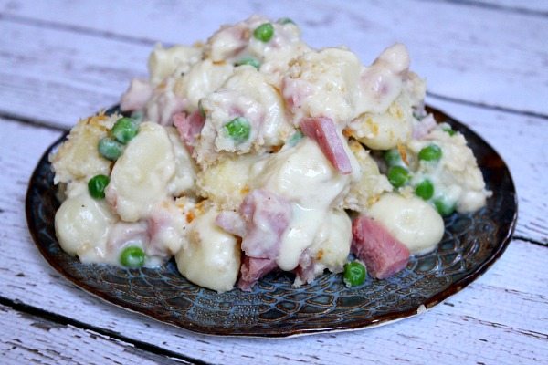Ham and Cheese Baked Gnocchi recipe from RecipeGirl.com #ham #cheese #gnocchi #recipe #RecipeGirl Ham and Swiss Baked Gnocchi on a serving plate