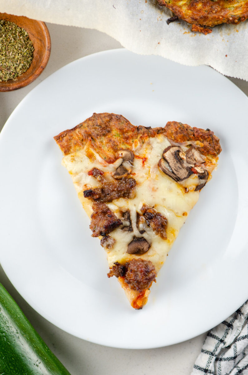 slice of pizza on a white plate