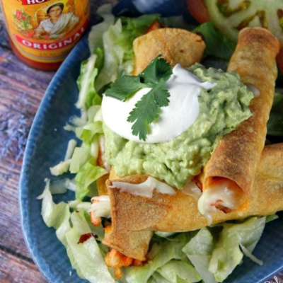 baked salmon taquitos on a plate