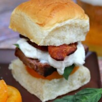 filet mignon caprese slider skewered with a sandwich pick. Beer on the side.