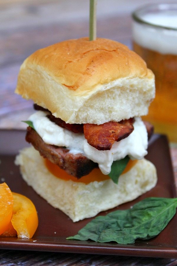 filet mignon caprese slider skewered with a sandwich pick. Beer on the side.