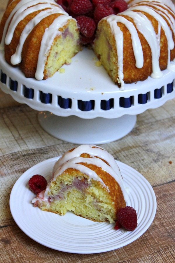 Raspberry Lemonade Bundt Cake with slice taken out and on serving plate