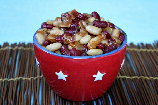 Sweet and Spicy Baked Beans in a red bowl with white stars