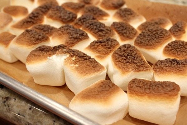 toasting marshmallows on a baking sheet