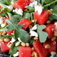 close up of watermelon, feta and arugula salad