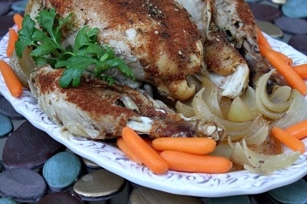 How to Cook a Whole Chicken in the Slow Cooker recipe from RecipeGirl.com #how #to #howto #diy #whole #chicken #slow #cooker #slowcooker #crockpot #recipe #RecipeGirl Slow Cooker Chicken on a platter