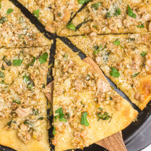white clam pizza sliced into pieces
