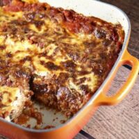 lasagna in a pan with a piece cut out