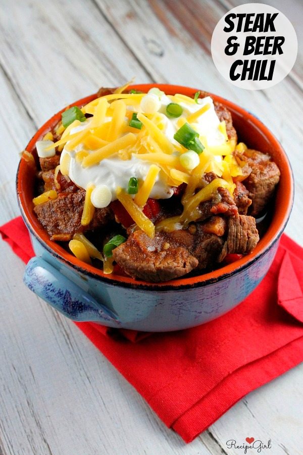 Steak and Beer Chili in a blue bowl on red napkin