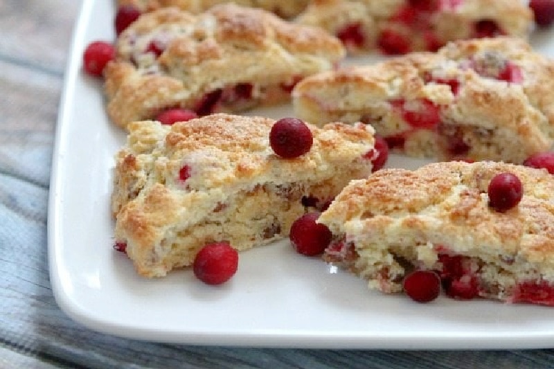 cranberry orange scones on a white plate