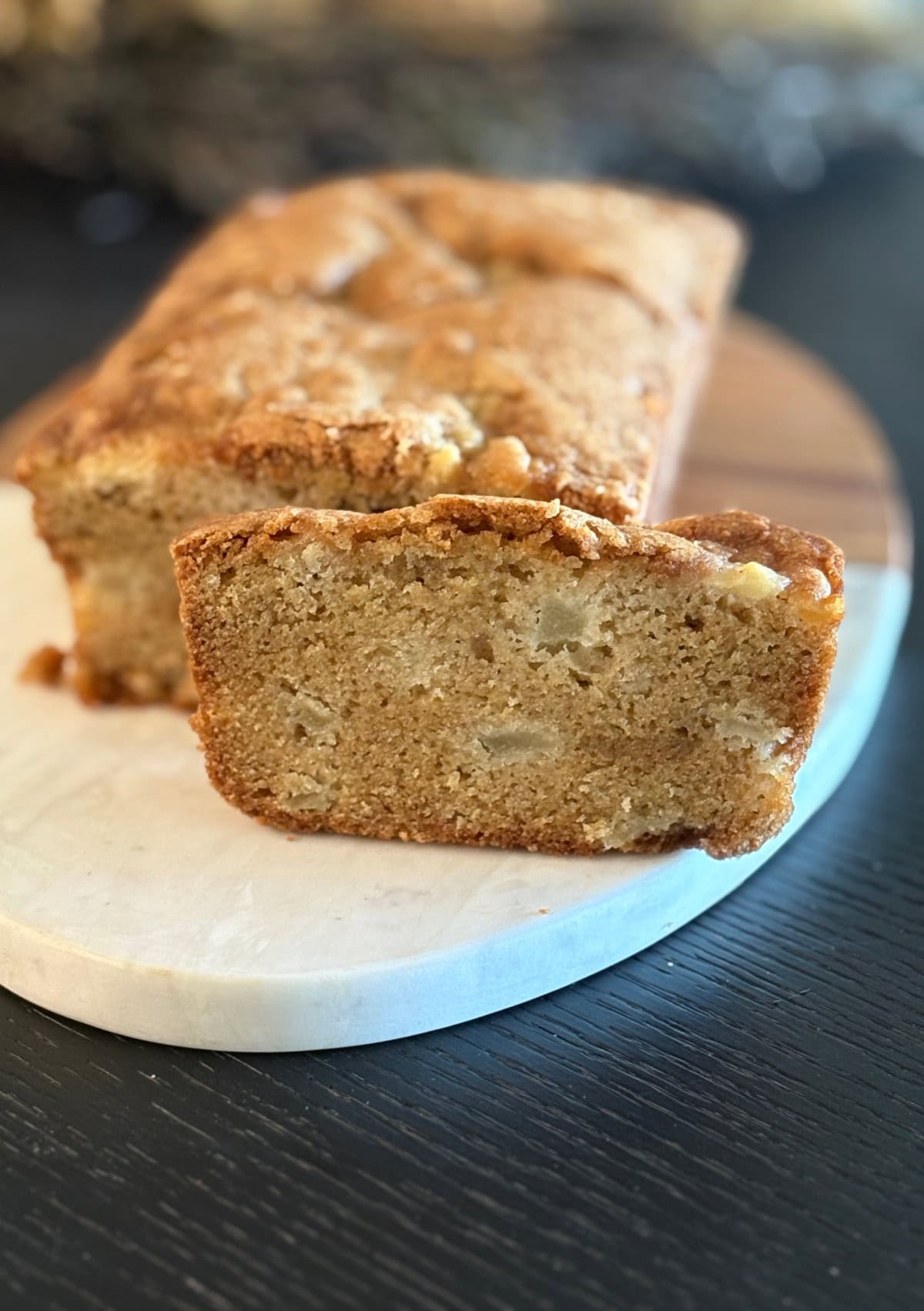 loaf of pear bread with one slice