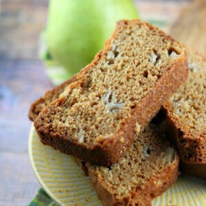 slices of pear bread with a fresh green pear